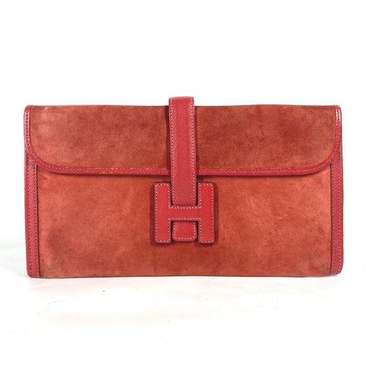 HERMES H logo Jige Elan clutch bag in red leather.