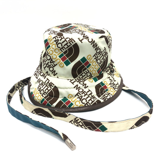 GUCCI 652942 Reversible Logo Bucket Hat in Collaboration with The North Face. Outdoor Nylon Hat, Unisex, White/Blue.