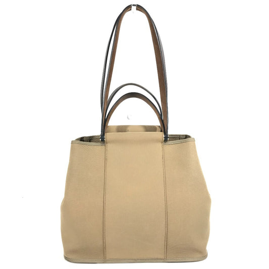HERMES Cabag PM, a handbag/shoulder bag in brown leather/canvas.