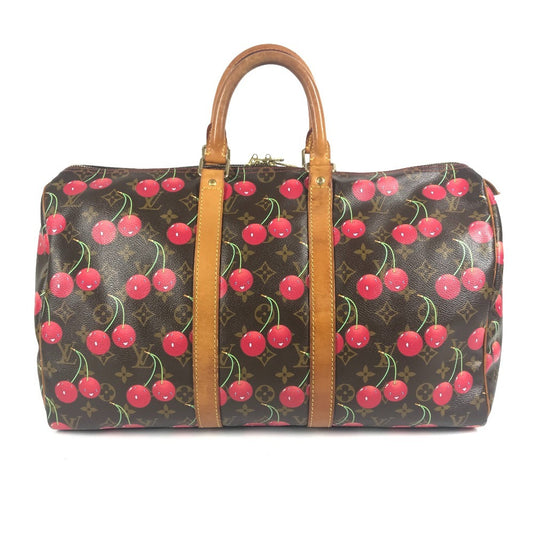 LOUIS VUITTON M95011 Monogram Cherry Keepall 45 by Takashi Murakami. This travel Boston bag is crafted in Monogram Cherry canvas and is available in brown.