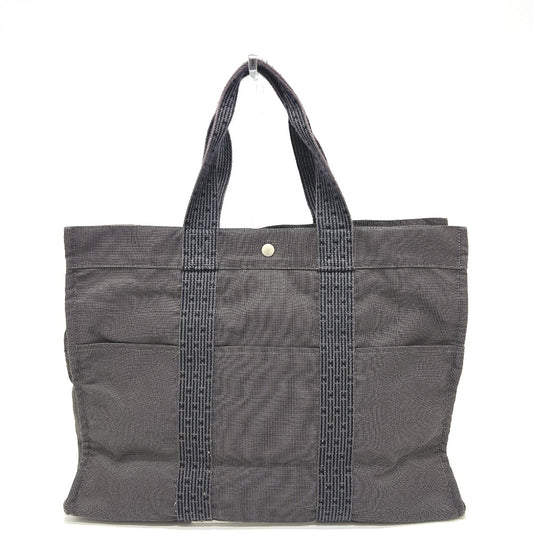 HERMES Air Line Tote GM, a men's handbag and tote bag in gray canvas.