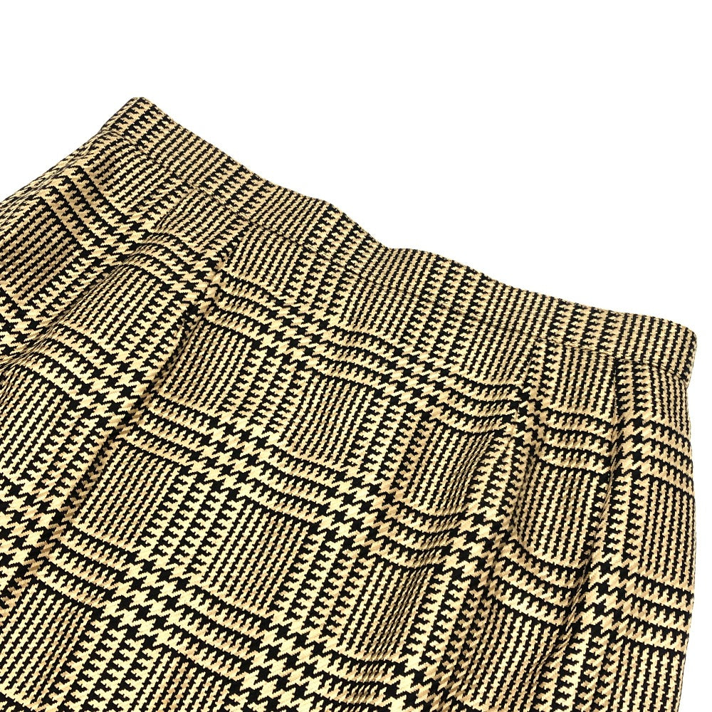 Burberrys Overall handle Suit set (jacket and skirt) with double-breasted jacket and skirt in a houndstooth pattern. Apparel. setup cotton Brown Used