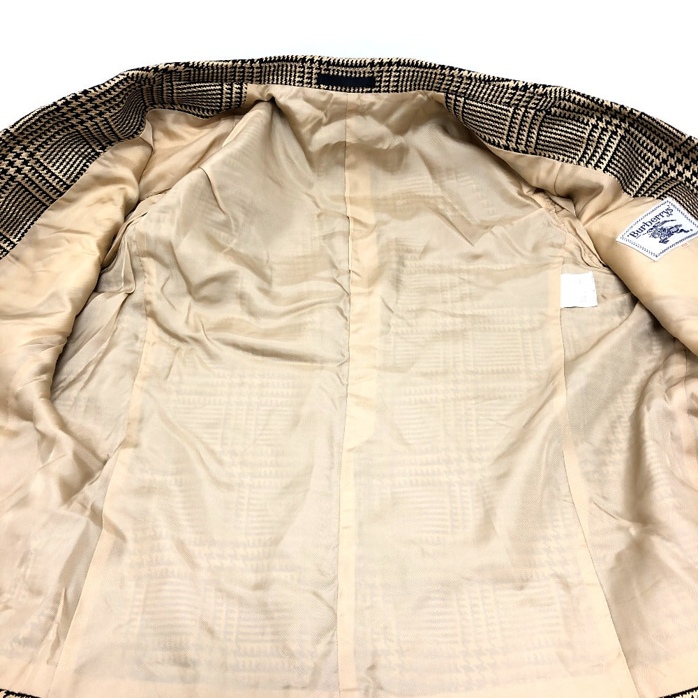 Burberrys Overall handle Suit set (jacket and skirt) with double-breasted jacket and skirt in a houndstooth pattern. Apparel. setup cotton Brown Used