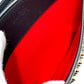 Christian Louboutin spiked studded Sky Pouch clutch bag in black leather.