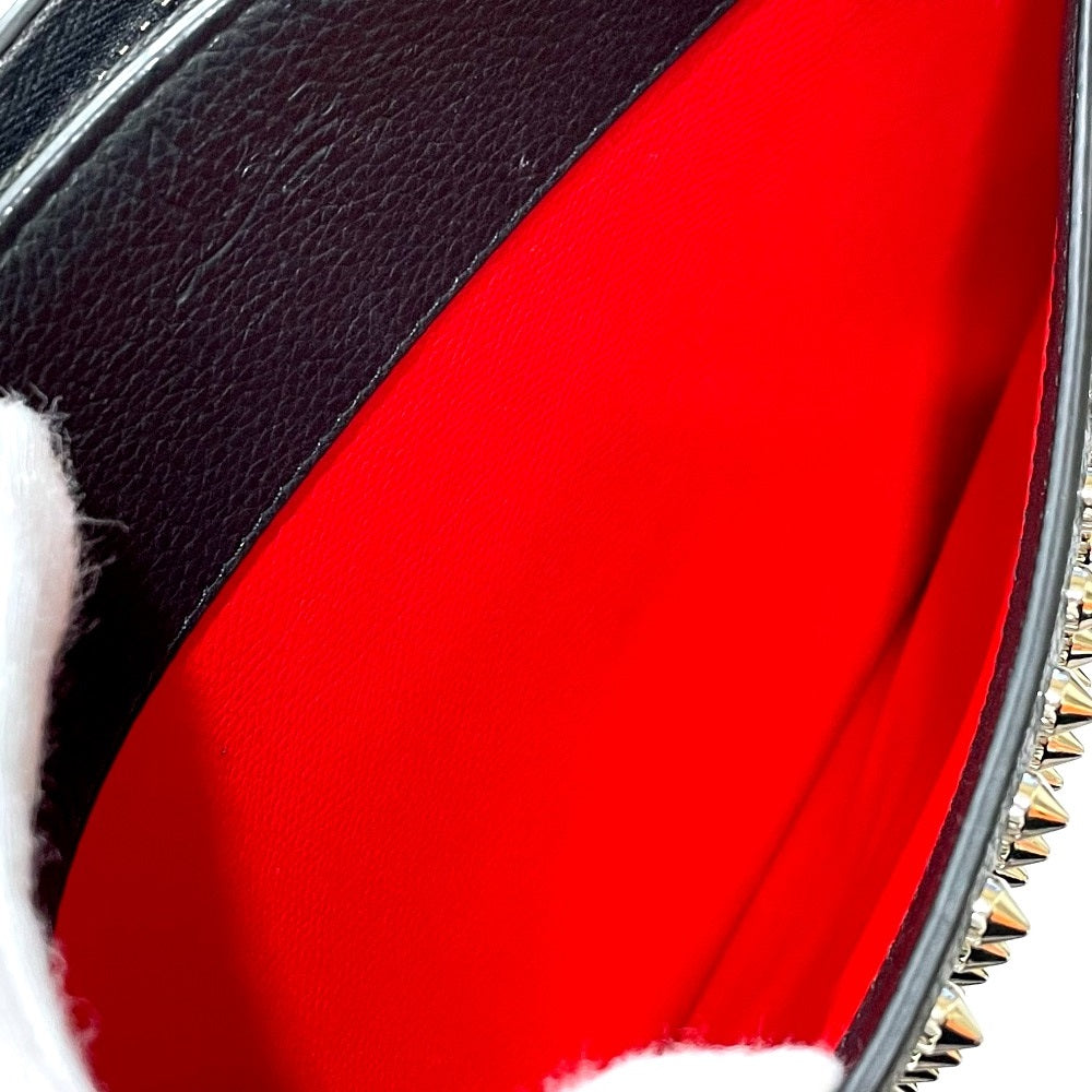 Christian Louboutin spiked studded Sky Pouch clutch bag in black leather.