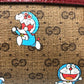 GUCCI 647784 GG Supreme Doraemon x GUCCI Shoulder Bag in GG Supreme Canvas, Brown, Women's
