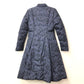 MONCLER EBONY GIUBBOTTO EBONY JACKET, featuring a metal logo and all-over print. This long-sleeved polyester down jacket is perfect for women and features a navy blue interior.
